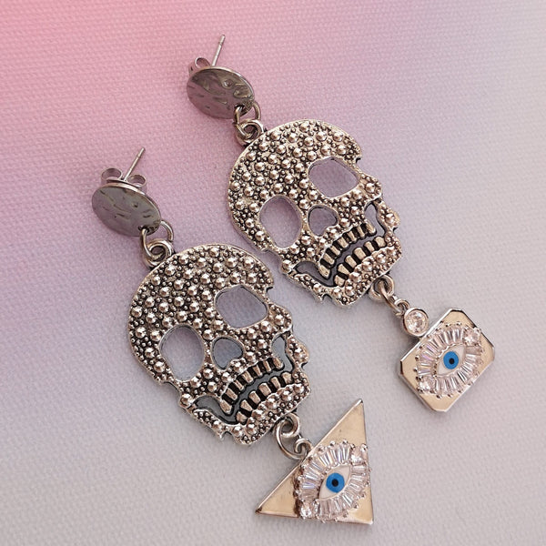 Brincos caveira e olho turco PAMPA MIA ®