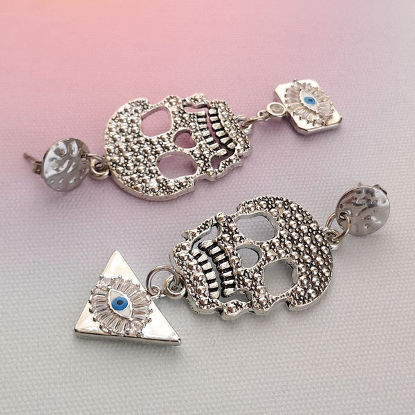 Brincos caveira e olho turco PAMPA MIA ®